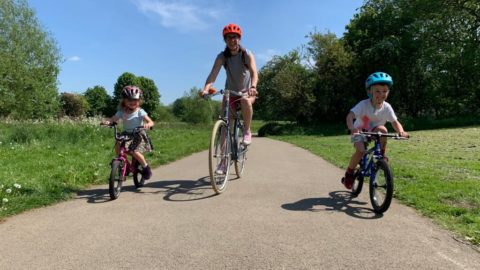 Mother and children cycling image
