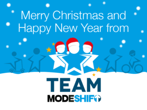 White text on blue background reads: Merry Christmas and Happy New Year from Team Modeshift