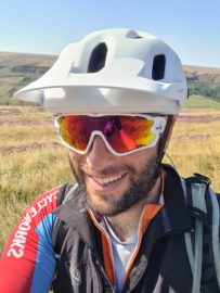 Steve Wrigley in cycling helmet and gear image