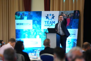 Modeshift's Ross Butcher on stage at the Modeshift Convention 2023