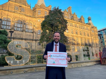 Cllr Ben Miskell, Chair of the Transport, Regeneration and Climate Policy Committee holds BetterPoints logo outside Sheffield Town Hall