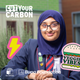 Girl wearing navy blue hijab, glasses, blue school blazer and black and red school tie sits with hands folded, smiling at camera. Text reads: Cut your Carbon. lightening bolt illustration to the right of her and illustration of a 'Veggie Vibes' burger to her right. Girl wearing navy blue hijab, glasses, blue school blazer and black and red school tie sits with hands folded, smiling at camera. Text reads: Cut your Carbon. lightening bolt illustration to the right of her and illustration of a 'Veggie Vibes' burger to her right. EchoSchools logo and Bupa Foundation logo