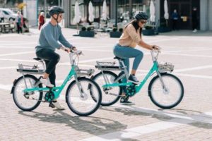 Two people using Beryl bikes image