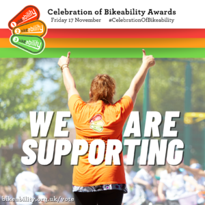 Graphic for Celebration Of Bikeability Awards, Friday 17 November. A Bikeability instructor is central, with her back to the camera. She is holding two ‘thumbs up’ in the air with arms extended. In the background school children can be seen on their bikes. The text ‘WE ARE SUPPORTING’ is layered over the subject. The link bikeability.org.uk/vote is at the bottom. 