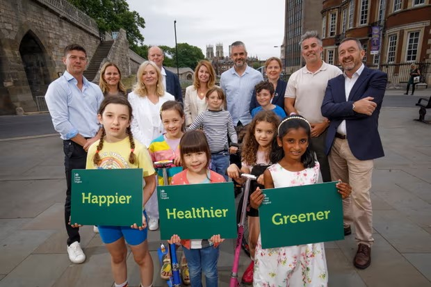 Luke Campbell, mayor of Hull and East Yorkshire; Kim McGuinness, mayor of North East; Tracy Brabin, mayor of West Yorkshire; Professor Sir Chris Whitty, chief medical officer for England; Helen Godwin, mayor of West of England; Oliver Coppard, mayor of South Yorkshire; Claire Ward, mayor of East Midlands, David Skaith, mayor of York and North Yorkshire; Chris Boardman, head of Active Travel England, with school children from York. Photograph: Supplied
