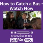 Two young students in school uniforms smile at each other while riding on a bus, with a thumbs-up icon and the text "How to Catch a Bus - Watch Now" overlayed on the image.