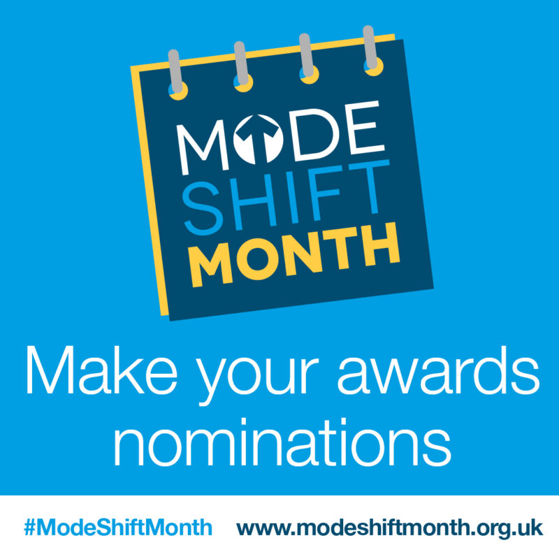 Graphic with a dark blue notepad icon featuring white and blue text "MODE SHIFT MONTH" and yellow accents. Below the icon, white text reads "Make your awards nominations". A hashtag and website address are at the bottom.